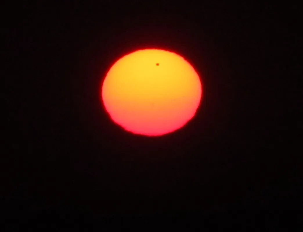 Transit of Venus 2012 just before sunrise with sunspot no 627