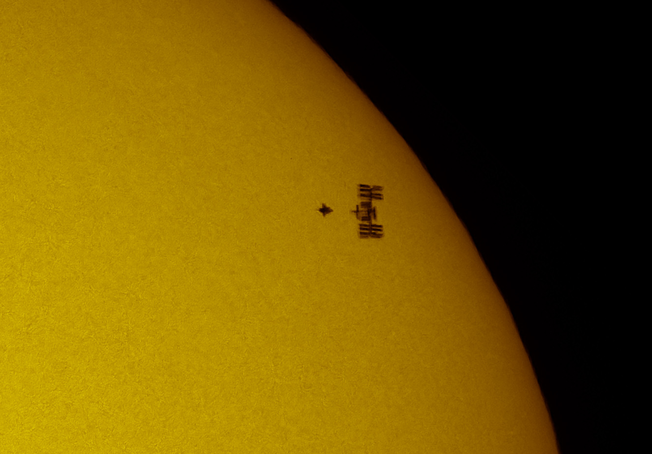 ISS and Atlantis shuttle on solar disk