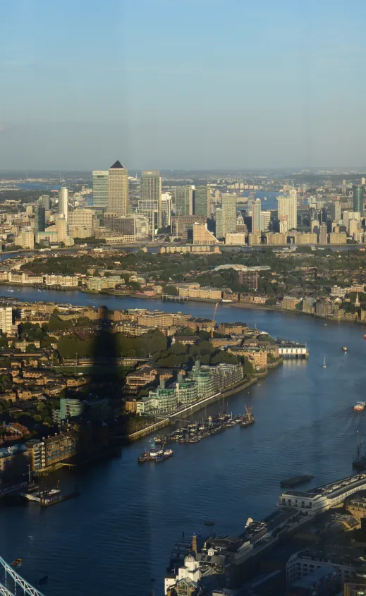 Canary Wharf, Thames river and The Shard's shadow before sunset