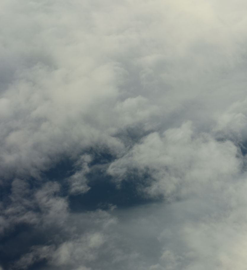 Contrast of cloud deck and ground underneath as seen from the plane