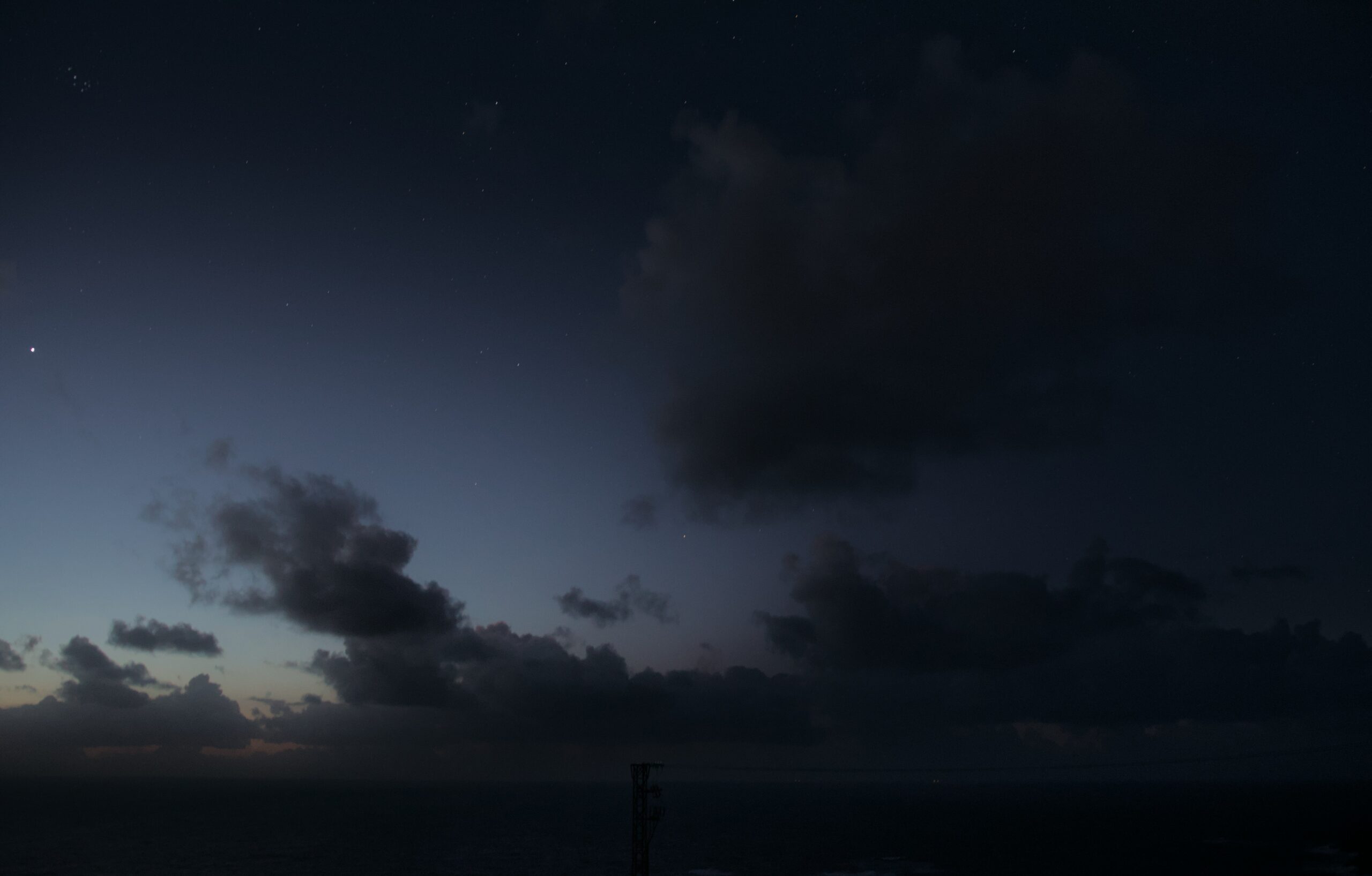 Solar eclipse below the horizon April 8, 2024 reddish band